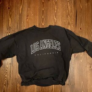 Brandy Melville oversized black crew sweatshirt.